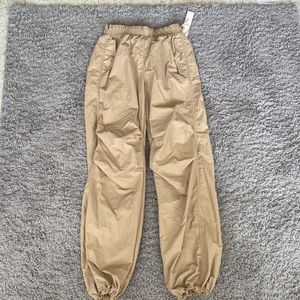 beige parachute pants never worn